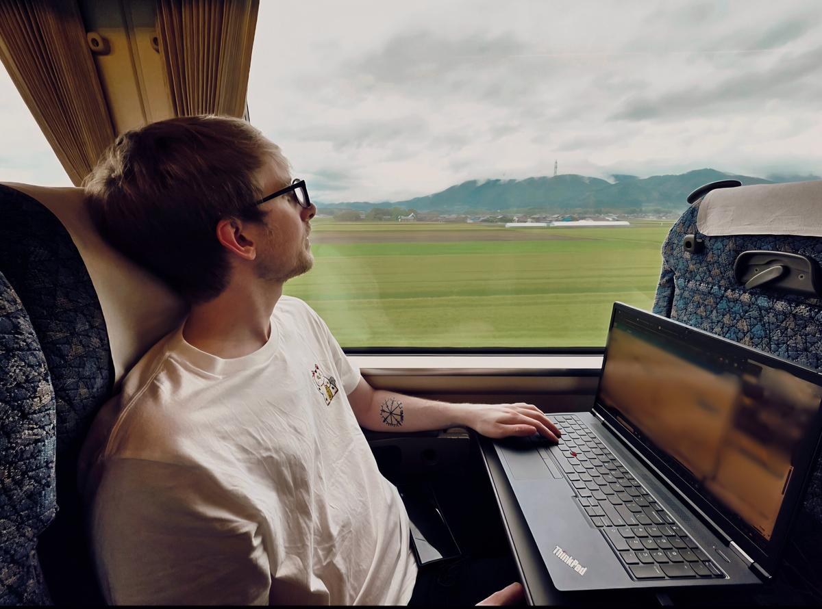 John on a train through rural Japan